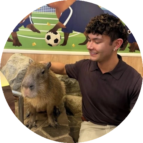 Jeremy petting a capybara